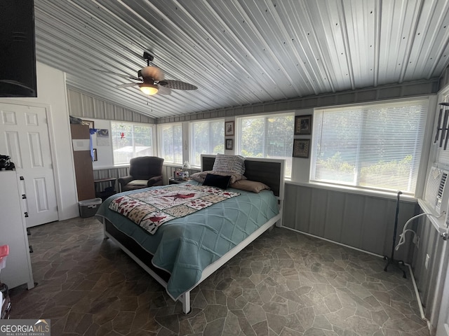 659 Voyles Rd, Carnesville, GA 30521 - bedroom with stone flooring, lofted ceiling, wooden ceiling, and a wainscoted wall