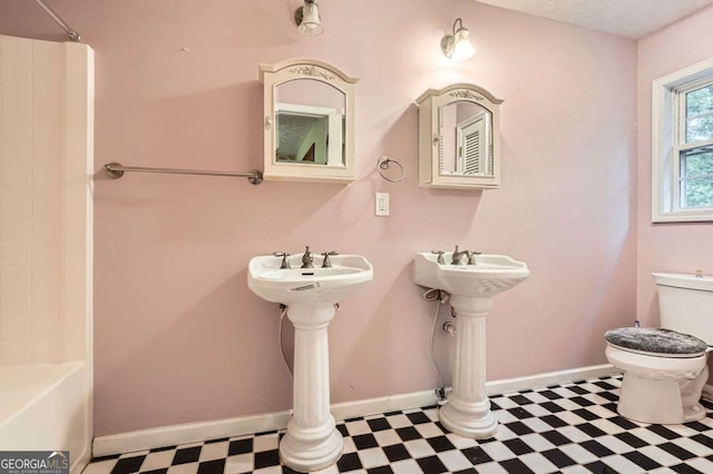 510 Aiken Dr, Dallas, GA 30157 - full bathroom featuring tile patterned floors, toilet, and baseboards