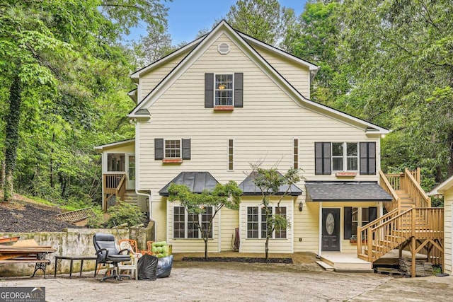 510 Aiken Dr, Dallas, GA 30157 - back of property featuring stairs and a sunroom