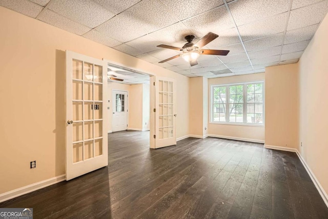 510 Aiken Dr, Dallas, GA 30157 - spare room featuring french doors, a drop ceiling, dark wood finished floors, a ceiling fan, and baseboards