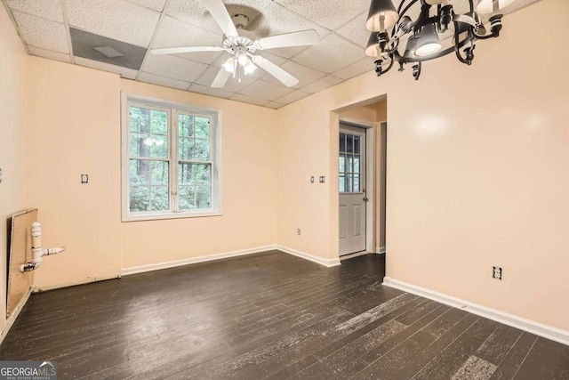 510 Aiken Dr, Dallas, GA 30157 - empty room featuring a drop ceiling, dark wood finished floors, a chandelier, baseboards, and ceiling fan
