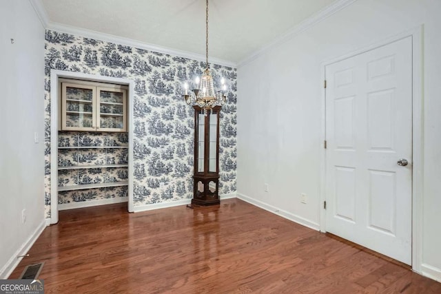 510 Aiken Dr, Dallas, GA 30157 - unfurnished dining area with a chandelier, wood finished floors, ornamental molding, and baseboards