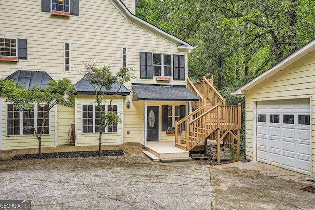 510 Aiken Dr, Dallas, GA 30157 - back of property featuring concrete driveway, stairway, and a garage