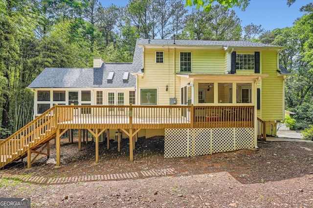 510 Aiken Dr, Dallas, GA 30157 - rear view of house with a sunroom, stairway, a deck, a chimney, and roof with shingles