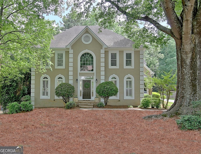 112 Windalier Rdg, Peachtree City, GA 30269 - colonial-style house with a shingled roof and stucco siding