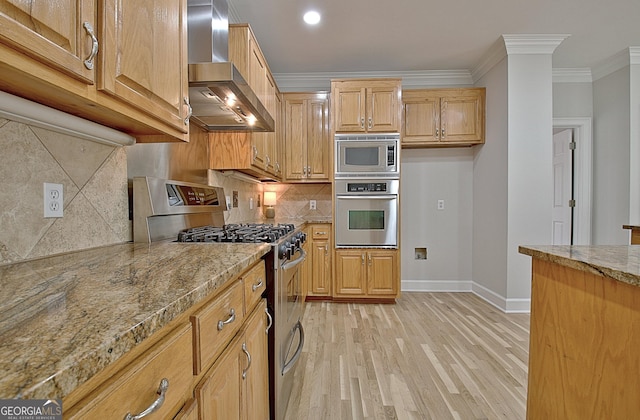 112 Windalier Rdg, Peachtree City, GA 30269 - kitchen featuring appliances with stainless steel finishes, wall chimney range hood, baseboards, crown molding, and light wood-type flooring