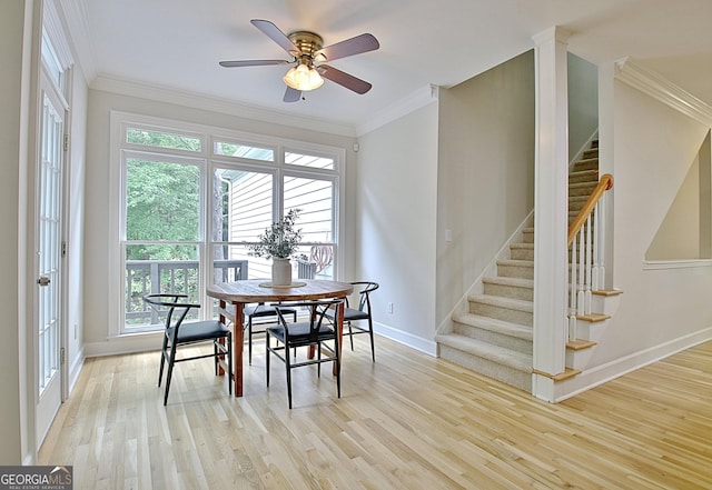 112 Windalier Rdg, Peachtree City, GA 30269 - dining space with baseboards, crown molding, light wood-style floors, stairs, and ceiling fan