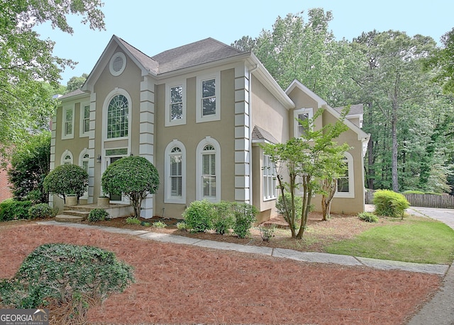 112 Windalier Rdg, Peachtree City, GA 30269 - view of property exterior featuring stucco siding and fence