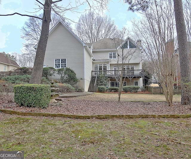 112 Windalier Rdg, Peachtree City, GA 30269 - rear view of property featuring stairway, a wooden deck, and a chimney