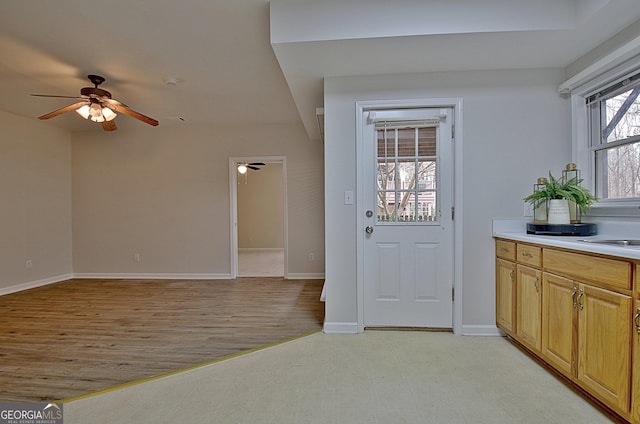 112 Windalier Rdg, Peachtree City, GA 30269 - doorway to outside featuring ceiling fan, light wood-style floors, and baseboards