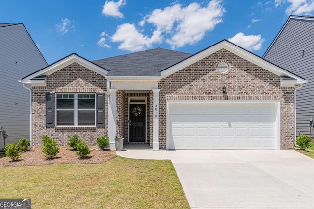 single story home with brick siding, a garage, driveway, a front yard, and roof with shingles