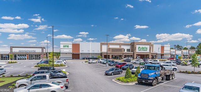 view of commercial property featuring uncovered parking