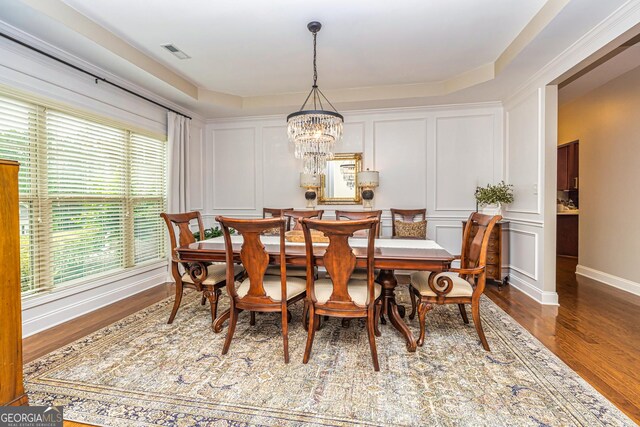 32 Meadow View Gln, Newnan, GA 30265 - dining area featuring a decorative wall, a chandelier, wood finished floors, and baseboards