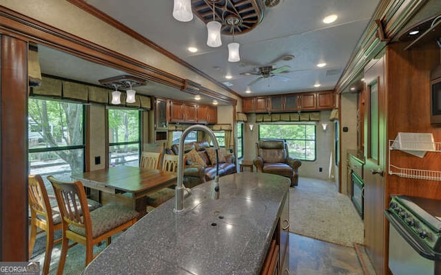 dining area with a ceiling fan, plenty of natural light, crown molding, and recessed lighting