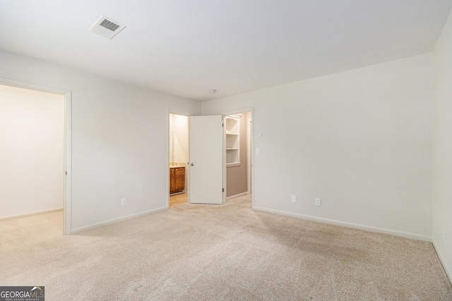 6900 Roswell Rd Unit F6, Atlanta, GA 30328 - unfurnished room featuring light carpet and baseboards