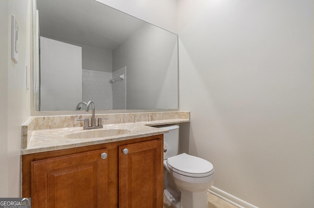 6900 Roswell Rd Unit F6, Atlanta, GA 30328 - bathroom featuring toilet, vanity, baseboards, and a shower