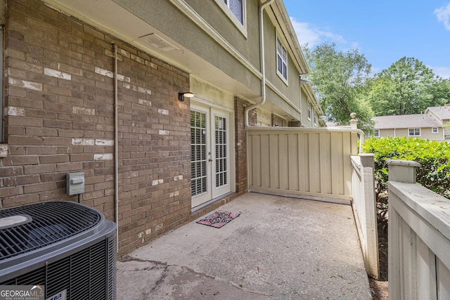6900 Roswell Rd Unit F6, Atlanta, GA 30328 - view of patio featuring french doors and cooling unit