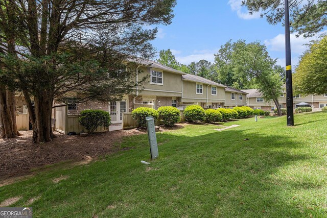 6900 Roswell Rd Unit F6, Atlanta, GA 30328 - view of front of property with a front lawn and stucco siding