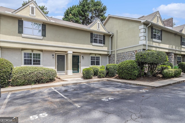 6900 Roswell Rd Unit F6, Atlanta, GA 30328 - multi unit property featuring stucco siding, uncovered parking, brick siding, and stone siding