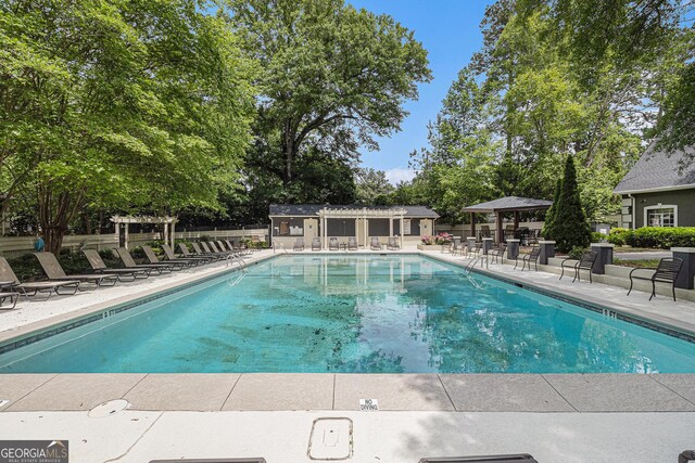 6900 Roswell Rd Unit F6, Atlanta, GA 30328 - community pool with a patio area