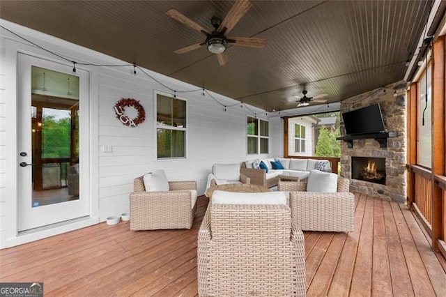 2149 Saddle Creek Dr, Jefferson, GA 30549 - wooden terrace with ceiling fan and an outdoor living space with a fireplace