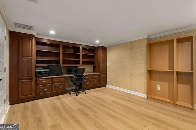 unfurnished office with built in study area, light wood-style flooring, baseboards, ornamental molding, and recessed lighting