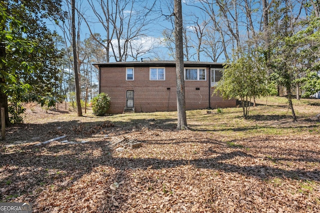 view of property exterior featuring brick siding