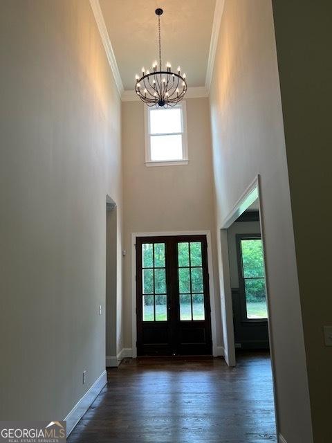 5907 SW Bunting Ln SW Unit 2, Atlanta, GA 30331 - doorway to outside with a chandelier, crown molding, wood finished floors, baseboards, and a towering ceiling