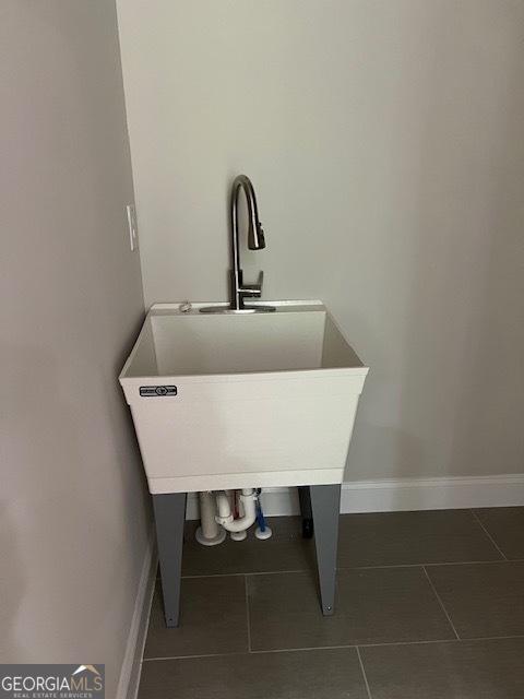 5907 SW Bunting Ln SW Unit 2, Atlanta, GA 30331 - detailed view of baseboards and a sink