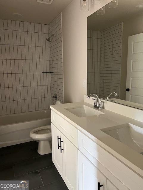 5907 SW Bunting Ln SW Unit 2, Atlanta, GA 30331 - bathroom featuring tile patterned flooring, toilet, shower / bath combination, and double vanity