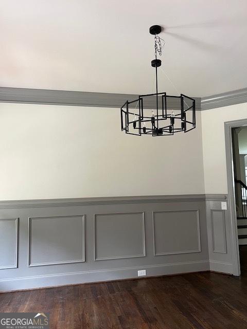 5907 SW Bunting Ln SW Unit 2, Atlanta, GA 30331 - detailed view of a chandelier, wainscoting, a decorative wall, and wood finished floors