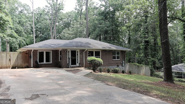 288 Harper Rd SE, Atlanta, GA 30315 - ranch-style home featuring brick siding, driveway, and roof with shingles
