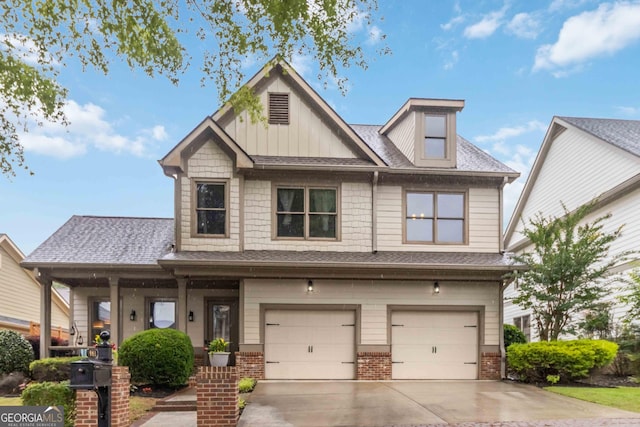 663 Warm Springs Ct, Loganville, GA 30052 - craftsman-style home featuring concrete driveway, an attached garage, brick siding, and a shingled roof