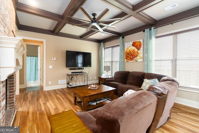 663 Warm Springs Ct, Loganville, GA 30052 - living room featuring coffered ceiling, a ceiling fan, wood finished floors, beam ceiling, and a fireplace