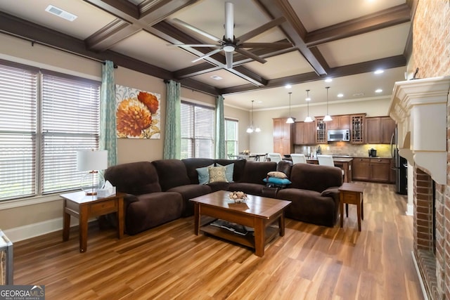 663 Warm Springs Ct, Loganville, GA 30052 - living room featuring light wood-type flooring, plenty of natural light, coffered ceiling, beamed ceiling, and a ceiling fan
