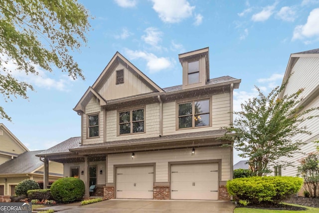 663 Warm Springs Ct, Loganville, GA 30052 - craftsman house with driveway, an attached garage, and brick siding