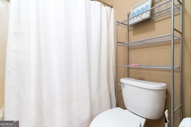663 Warm Springs Ct, Loganville, GA 30052 - bathroom featuring toilet and a shower with curtain