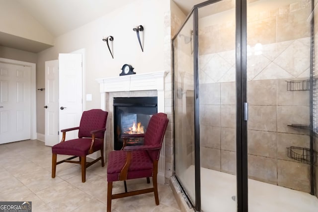 663 Warm Springs Ct, Loganville, GA 30052 - living area with lofted ceiling, light tile patterned flooring, and a premium fireplace