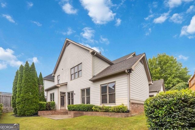 663 Warm Springs Ct, Loganville, GA 30052 - back of house with roof with shingles