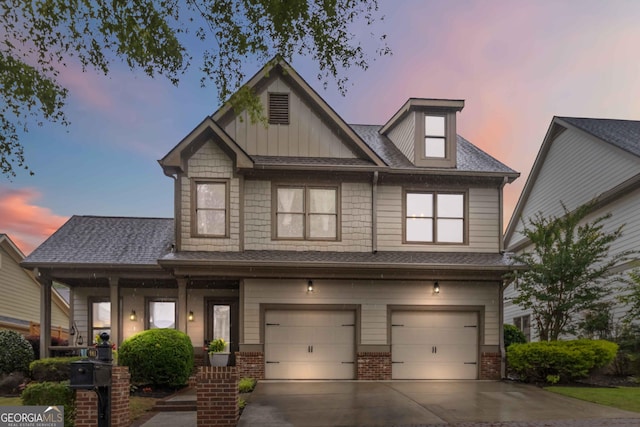663 Warm Springs Ct, Loganville, GA 30052 - craftsman house featuring driveway, a garage, brick siding, a porch, and roof with shingles