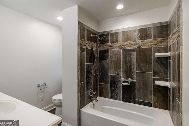 bathroom featuring toilet, shower / bath combination, baseboards, recessed lighting, and a sink