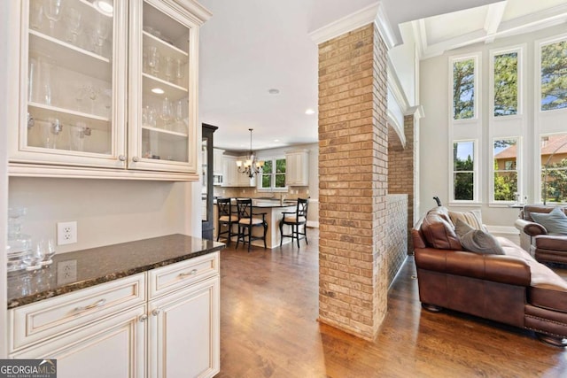 3456 Glen Mist Pl, Dacula, GA 30019 - bar area with wood finished floors, recessed lighting, a chandelier, ornamental molding, and beam ceiling