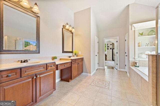 3456 Glen Mist Pl, Dacula, GA 30019 - bathroom featuring lofted ceiling, double vanity, a bath, tile patterned floors, and baseboards
