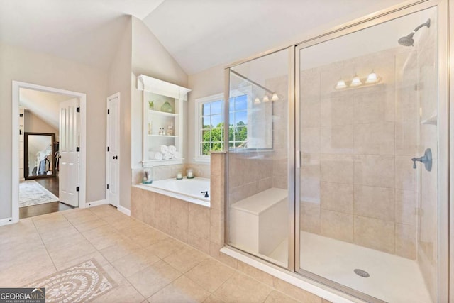 3456 Glen Mist Pl, Dacula, GA 30019 - bathroom with a stall shower, a garden tub, tile patterned floors, lofted ceiling, and baseboards