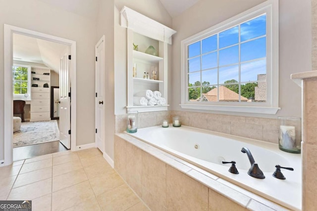 3456 Glen Mist Pl, Dacula, GA 30019 - bathroom featuring a whirlpool tub, tile patterned floors, baseboards, and built in shelves