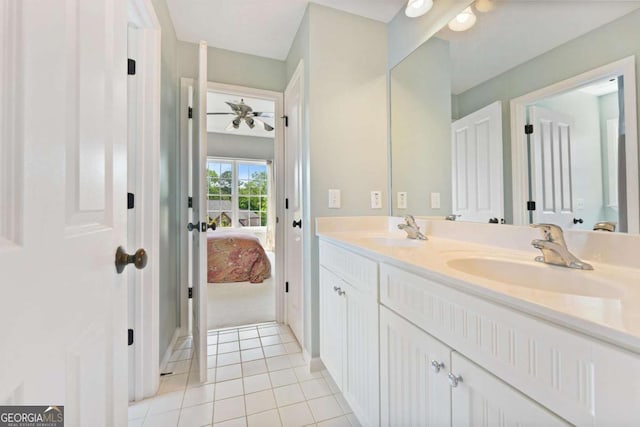3456 Glen Mist Pl, Dacula, GA 30019 - full bathroom featuring ensuite bath, double vanity, tile patterned floors, and ceiling fan