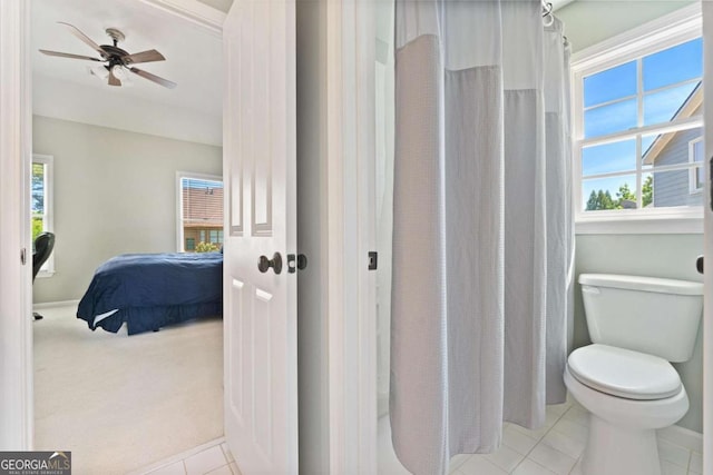 3456 Glen Mist Pl, Dacula, GA 30019 - bathroom featuring connected bathroom, toilet, tile patterned flooring, a ceiling fan, and a shower with curtain