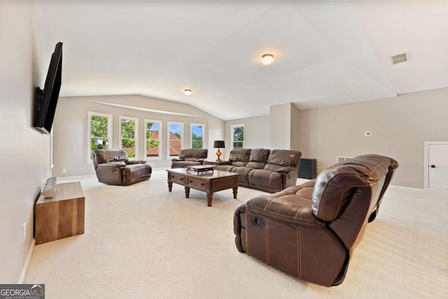 3456 Glen Mist Pl, Dacula, GA 30019 - living room featuring vaulted ceiling, light carpet, and baseboards