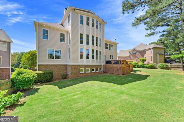 3456 Glen Mist Pl, Dacula, GA 30019 - back of property with a deck, brick siding, and a chimney