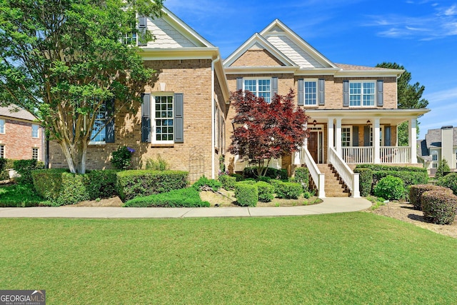 3456 Glen Mist Pl, Dacula, GA 30019 - view of front facade featuring brick siding, a front lawn, stairs, and a porch